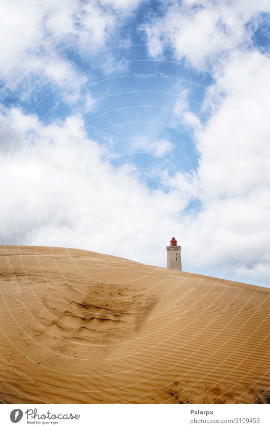 Lighthouse rising up behind a sand dune Beautiful Vacation & Travel Beach Ocean House (Residential Structure) Environment Nature Landscape Sand Sky Clouds Coast