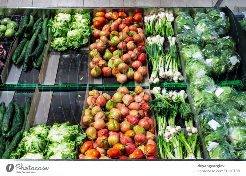 Vegetables on shelf in supermarket. Food Shopping Marketplace Stand Sell Fresh Red Tradition Supermarket Greengrocer Customer Tomato Salad peppers Mature