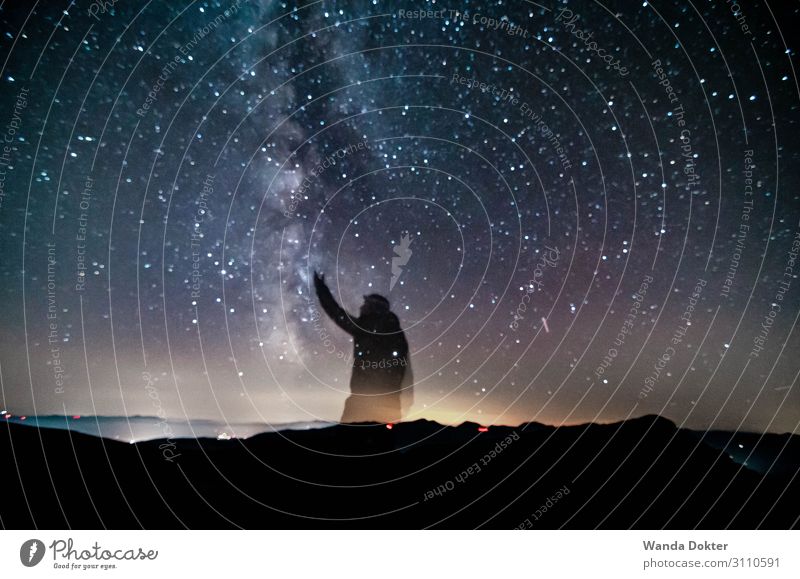 Reach for the Stars Body 1 Human being Nature Landscape Air Sky Night sky Horizon Autumn Alps Mountain Observe Touch Discover Glittering Illuminate Study Hiking