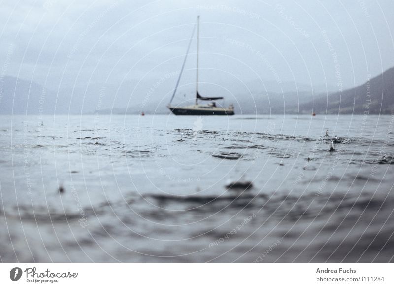 Sailing boat on lake Attersee in rain Sailboat Thunder and lightning Storm Lake Rain Aquatics Nature Landscape Water Drops of water Storm clouds Summer Waves