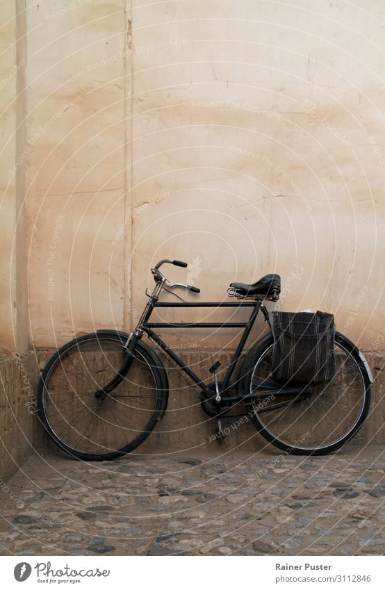 Old bicycle in front of the house wall Wall (barrier) Wall (building) Bicycle Pink Black Calm Senior citizen Stagnating Colour photo Exterior shot