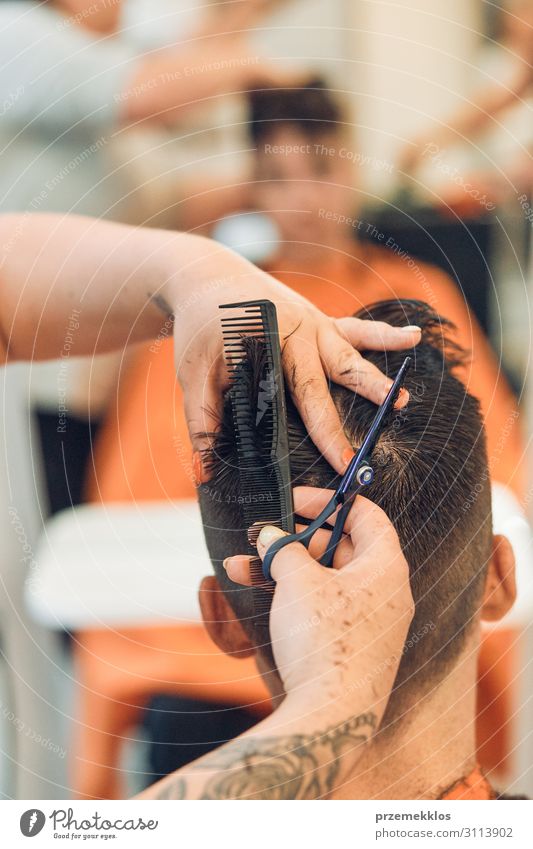 Hairdresser Is Haircutting Styling Young Mans Hair A Royalty