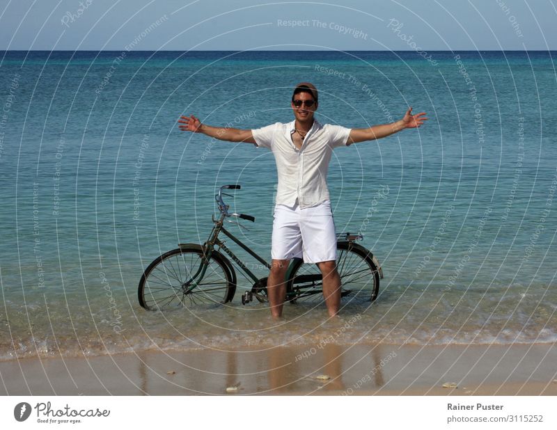 Young man with bicycle in the sea Cycling Bicycle Masculine Youth (Young adults) 1 Human being 18 - 30 years Adults Water Cloudless sky Sun coast Beach Ocean