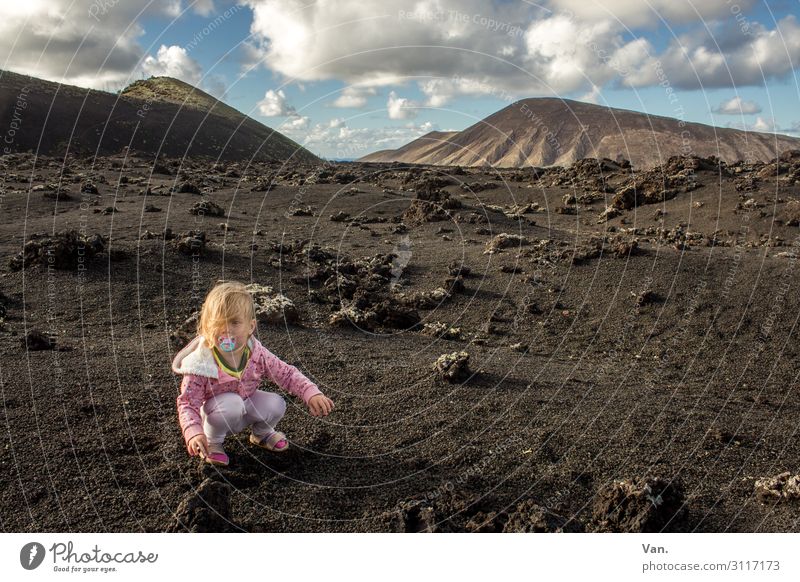 dashes of colour Landscape Lanzarote vacation Nature Girl Toddler Pink Sparse Mountain Hill Volcanic Sky Clouds Child stones Vacation & Travel Exterior shot