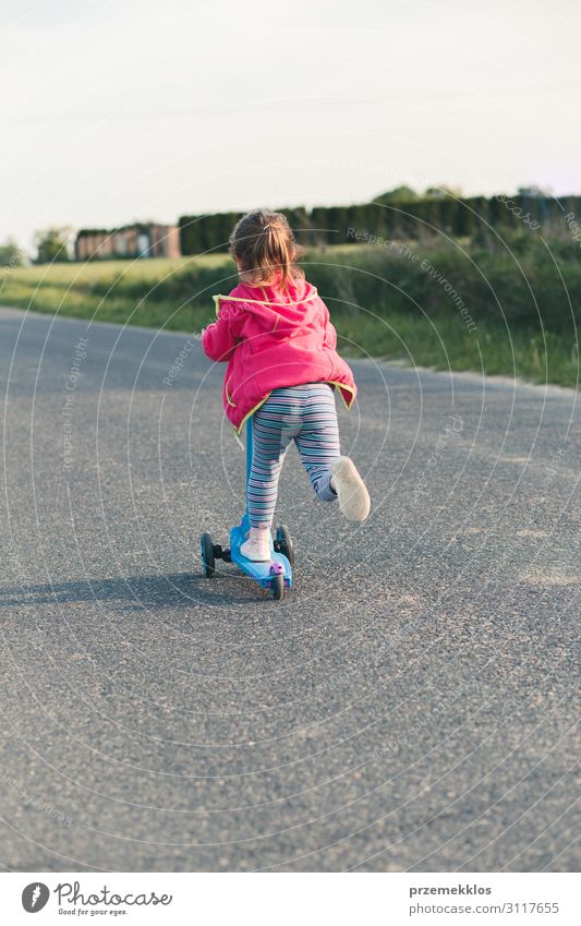 Young girl riding on roller skates Lifestyle Joy Happy Beautiful Relaxation Leisure and hobbies Playing Freedom Summer Summer vacation Ride Child Girl 1