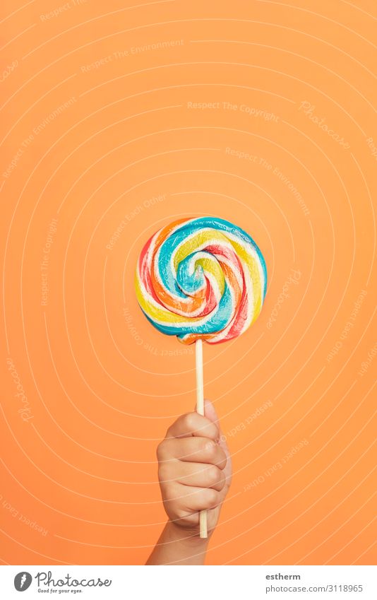 Child's hand with Colorful lollipop Food Dessert Candy Nutrition Eating Joy Human being Masculine Infancy Hand Fingers 1 8 - 13 years To hold on Feeding Healthy