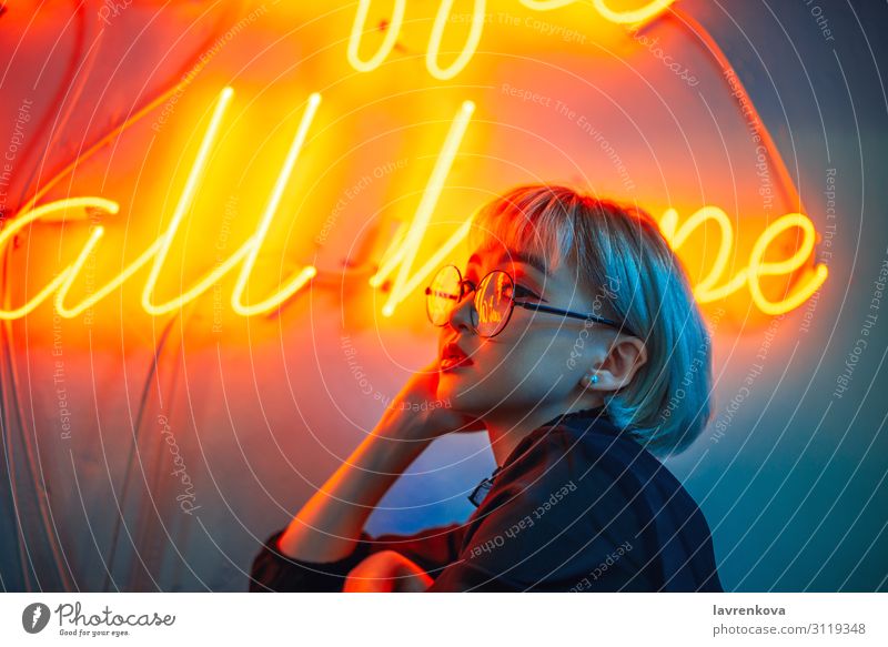 Asian female wearing glasses in front of neon light sign Neon light Asians Woman Young woman Youth (Young adults) 18 - 30 years Eyeglasses Light Lighting