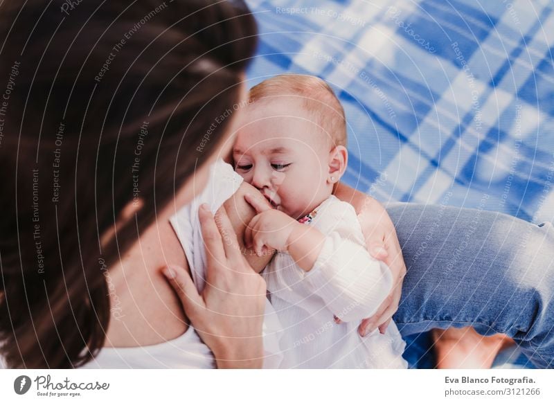 young mother breast feeding her baby girl outdoors in a park Eating Lifestyle Joy Beautiful Summer Sun Parenting Child Feminine Baby Young woman