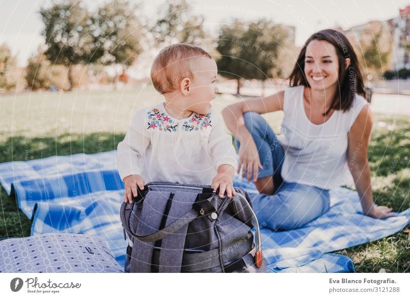 mother playing with baby girl outdoors in a park.family concept Lifestyle Joy Beautiful Playing Summer Sun Parenting Child Baby Young woman Youth (Young adults)