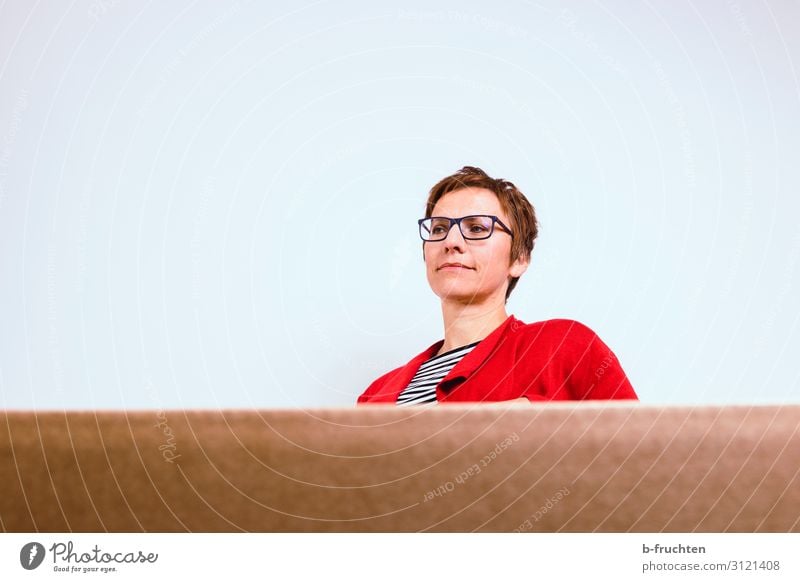 Woman sitting, next to a white wall, in front of a cardboard box Room Services Business Meeting To talk Adults 1 Human being 30 - 45 years Observe Looking Sit