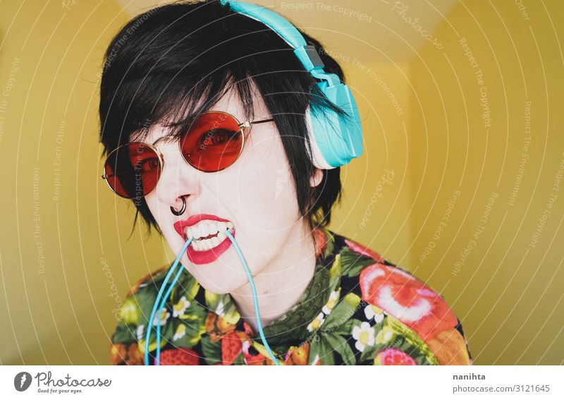 Cool young androgynous dj woman Lifestyle Style Joy Hair and hairstyles Music Disc jockey Headset Technology Androgynous Woman Adults Fashion Sunglasses