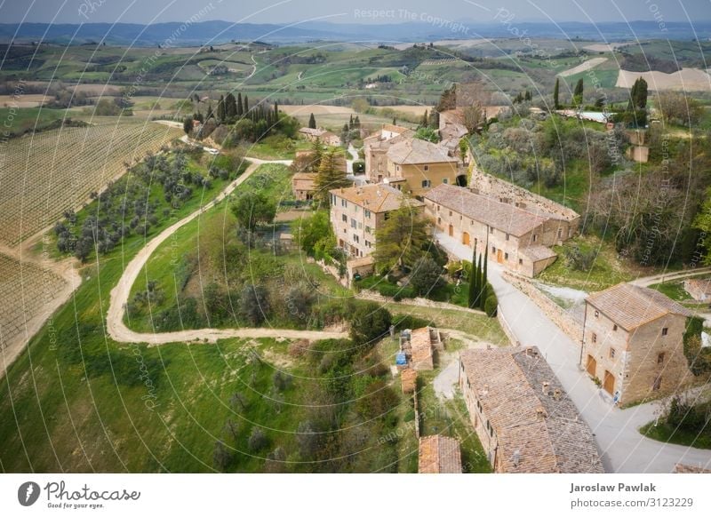 The tiny town of Lucignano d'Asso, taken from above, flying a drone. lucignano stone building nobody village italy europe ancient house medieval tuscany old