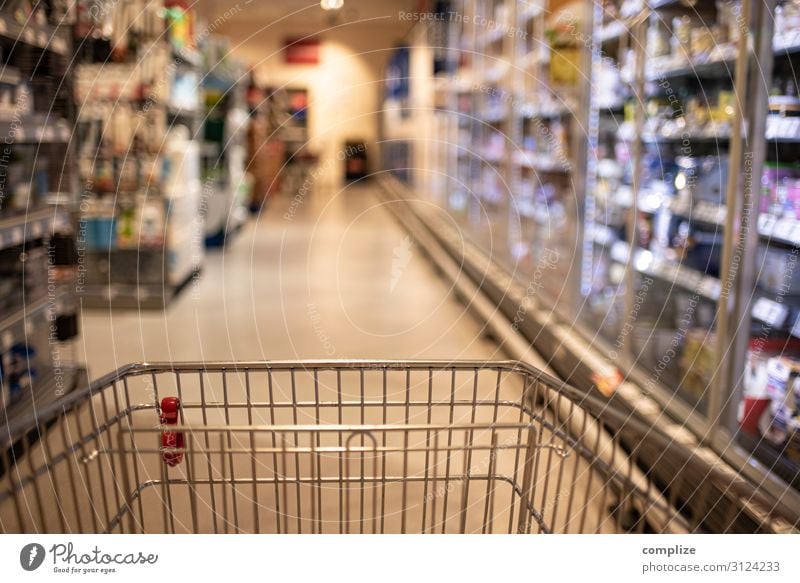 Empty shopping cart in the supermarket corridor Food Nutrition Lifestyle Shopping Healthy Leisure and hobbies Living or residing Trade Logistics