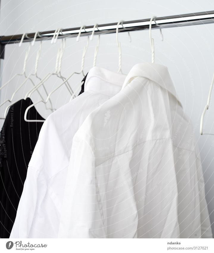 white men's crumpled shirts hanging on a metal hanger Shopping Masculine Fashion Clothing Shirt Dress Hang Clean White Home many wrinkled service wear rack
