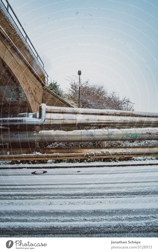 Wide-angle industrial winter landscape with snowflakes Street Winter Aqueduct Bridge Cold Freedom Frozen Industrial Exterior shot Iron-pipe Snow Snowflake