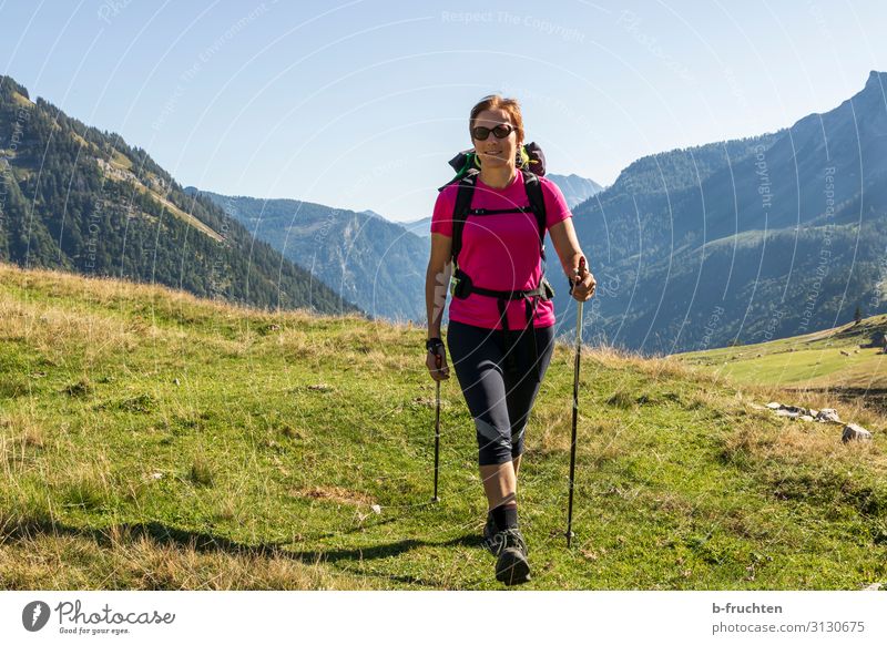 Woman with rucksack and walking sticks Life Trip Adventure Freedom Summer Mountain Hiking Adults 1 Human being Nature Autumn Beautiful weather Alps Going