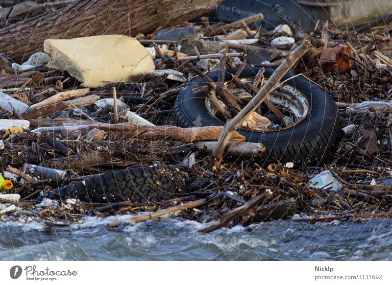 Garbage and flotsam in the Rhine near Cologne (flood) Environment Water River Waves Trash Driftwood Car tire Foam rubber Packaging PE bottle Tin Metal Plastic