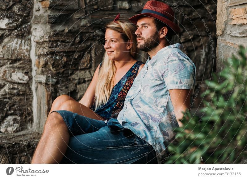 Young couple sitting on the stairs in an old village Lifestyle Joy Vacation & Travel Tourism Summer Summer vacation Human being Masculine Feminine Young woman