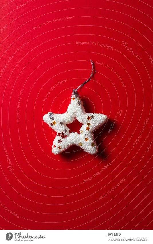 Shiny white Christmas star on red background, minimal concept Winter Decoration Feasts & Celebrations Christmas & Advent Collection Ornament String Glittering