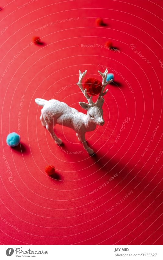 White reindeer toy with small balls of wool on red background Winter Decoration Feasts & Celebrations Christmas & Advent Art Animal Fashion Ornament New Red
