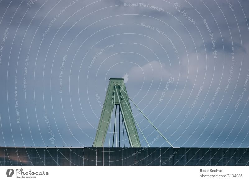 Bridge pillar in front of evening rain sky Bad weather Rain Metal Firm Tall Gloomy Blue Gray Green Power Apocalyptic sentiment Bridge pier Stability