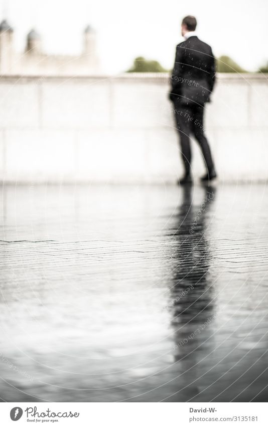 leave someone out in the rain - businessman out in the rain... on the wet street his shadow is reflected Businessman Man Work and employment Human being Suit