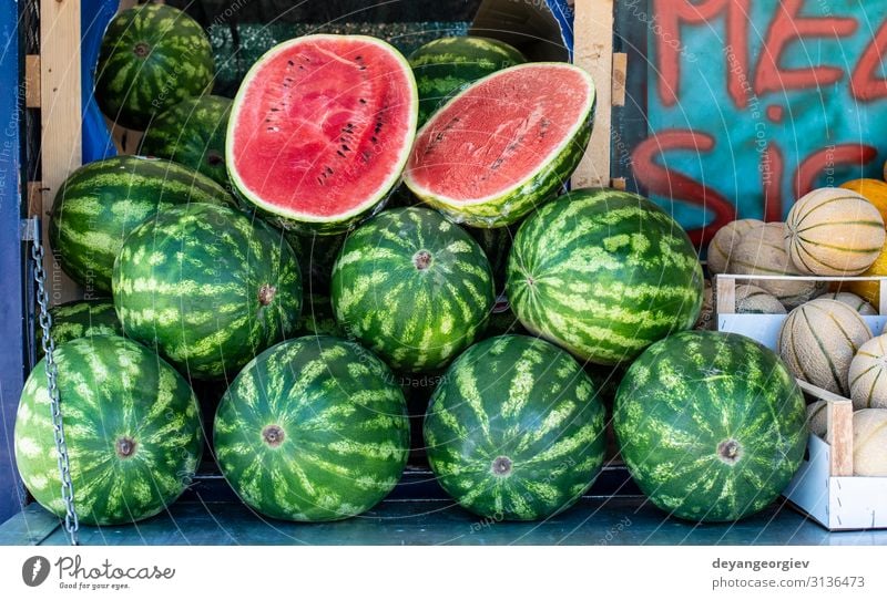 Watermelons on shelf. Cutted watermelon on street market Food Fruit Nutrition Diet Shopping Summer Marketplace Fresh Delicious Natural Juicy Red Water melon