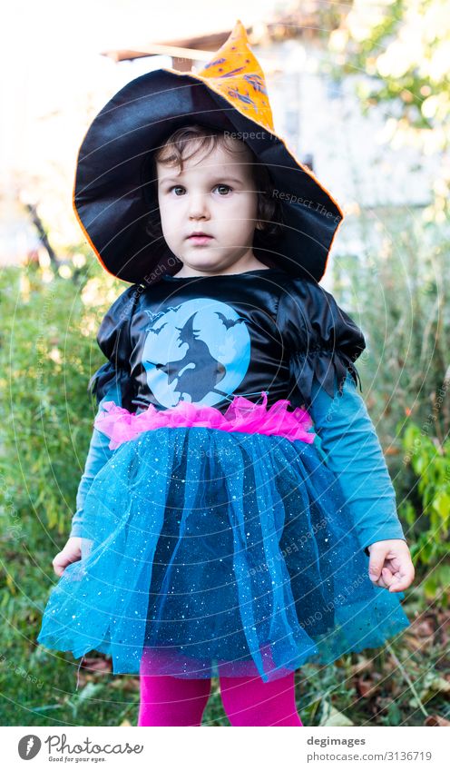 A little girl with a Halloween costume. Joy Happy Feasts & Celebrations Hallowe'en Child Infancy Autumn Dress Hat Dark Small Black Horror Tradition Witch