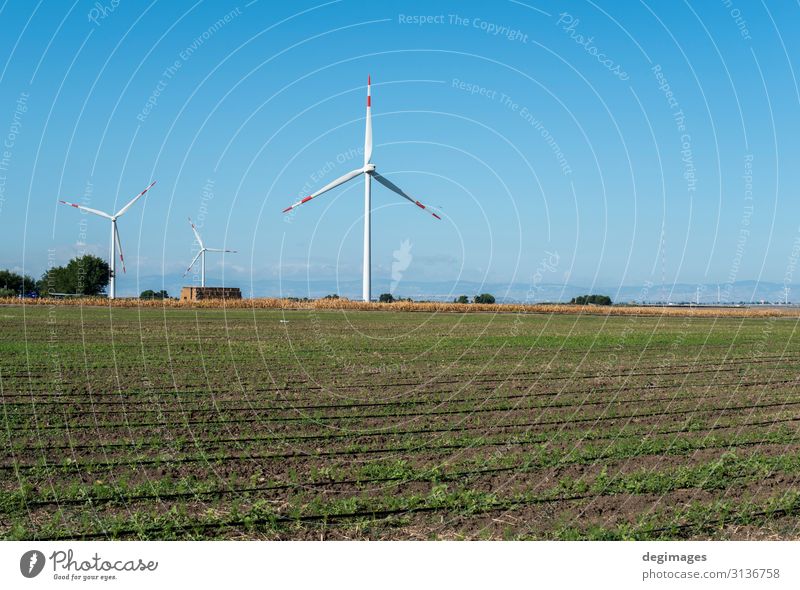 Wind generator and agricultural land. Industry Technology Wind energy plant Environment Nature Landscape Sky Sustainability Blue Green Energy Renewable field