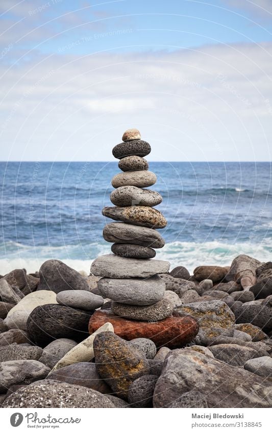 Stone stack on a beach, balance and harmony concept. Lifestyle Alternative medicine Wellness Harmonious Well-being Contentment Relaxation Meditation Beach Ocean