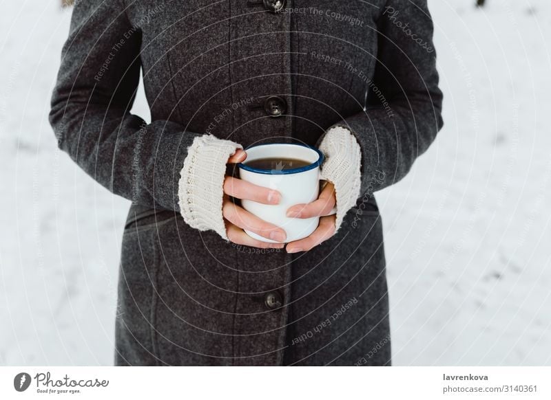 Woman's hands holding white enamel cup with hot drink Walking To go for a walk Hiking Young woman Hand Morning Caffeine Hold Cup Mug Beverage Breakfast Fingers