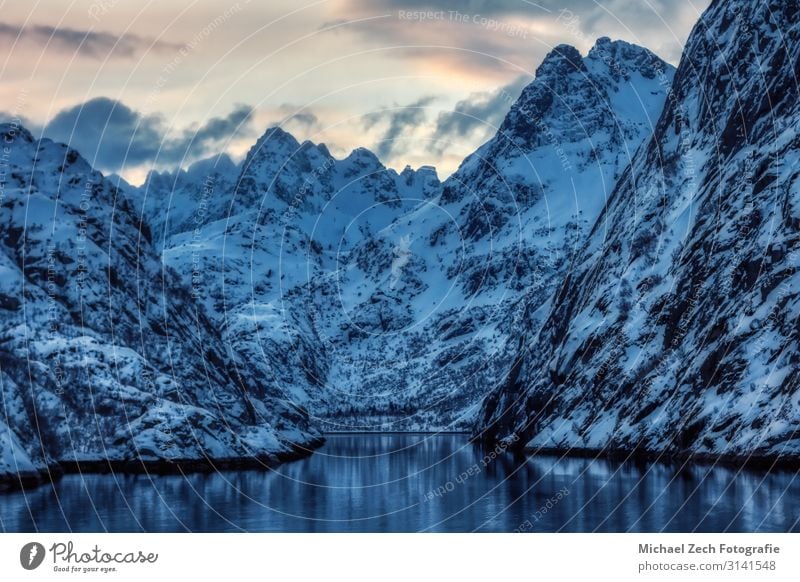 View to the entry of Trollfjord with snow-capped mountains Beautiful Adventure Island Winter Snow Mountain Hiking Climbing Mountaineering Nature Landscape Rock