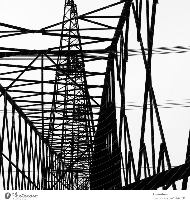 Metal skywards Energy industry Technology Line Esthetic Cold Black White Electricity pylon High voltage power line Construction Power transmission