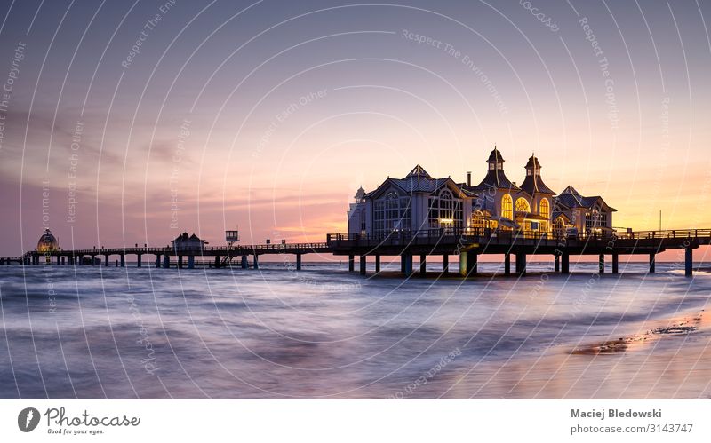 Pier in Sellin at purple sunrise, Germany. Vacation & Travel Tourism Sightseeing Summer Summer vacation Beach Ocean Island Waves Landscape Sky Coast Baltic Sea