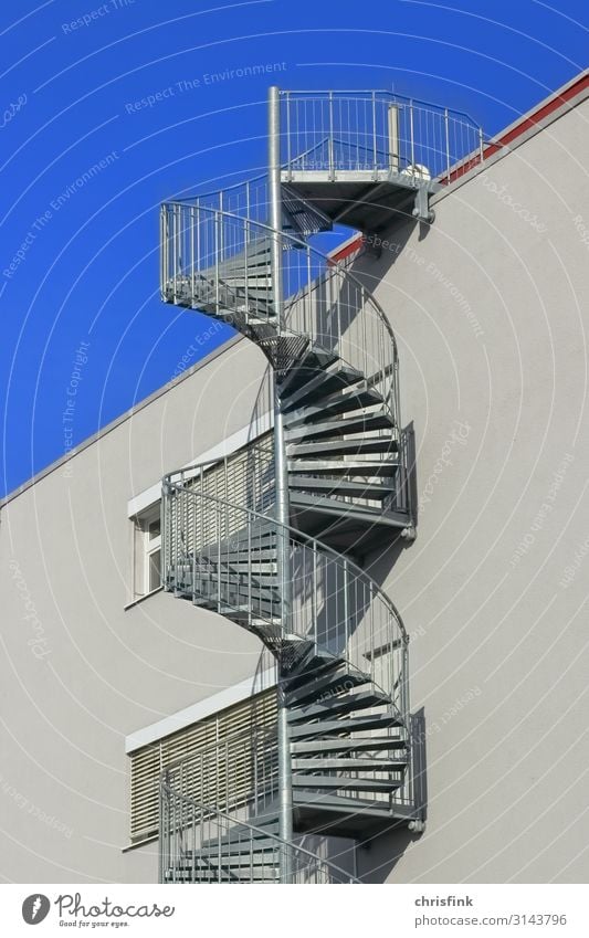spiral staircase on house wall House (Residential Structure) Industrial plant Manmade structures Building Architecture Wall (barrier) Wall (building) Stairs