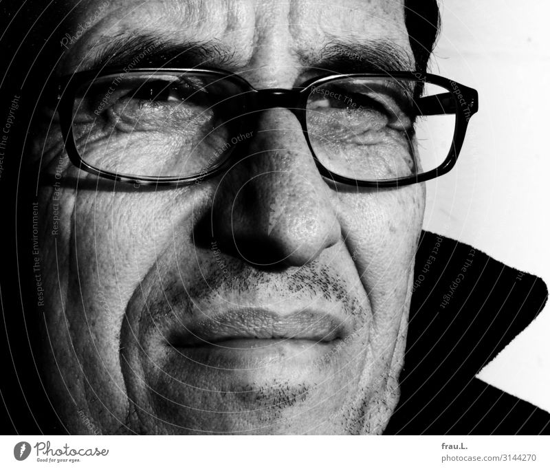 tense Human being Man Adults Life Face 45 - 60 years Observe Looking pretty Eyeglasses Stubble Sunlight Attractive Black & white photo Exterior shot Day
