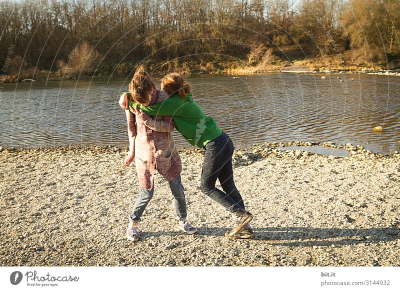 Two teenagers fighting at the waterfront Playing Martial arts Parenting Human being Feminine Young woman Youth (Young adults) Brothers and sisters Sister