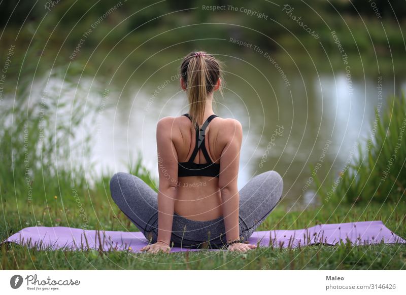 Yoga exercises in the open air / A young girl / Portrait Action Attractive pretty Body Practice Woman Feminine Healthy Athletic Fitness Girl Glamor Grass Green
