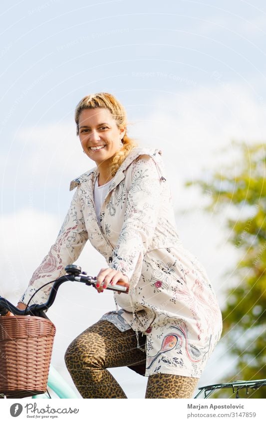 Young happy woman riding a bicycle in the city Joy Athletic Life Cycling Bicycle Feminine Young woman Youth (Young adults) Woman Adults 1 Human being