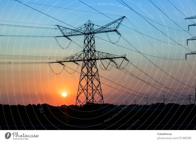 Sunset, power lines cross the evening sky, a large power pole can be seen High voltage power line Technology Energy industry Solar Power Electricity Nature