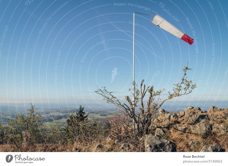 Red and white in the wind Landscape Cloudless sky Beautiful weather Hill Hiking Far-off places Wind Windsock Vane Rhön Wasserkuppe Colour photo Exterior shot