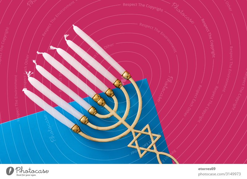 Jewish Hanukkah menorah on blue and pink background hanukkah Menorah-im Candle Illuminate Feasts & Celebrations Israeli Public Holiday Gold candelabrum Culture