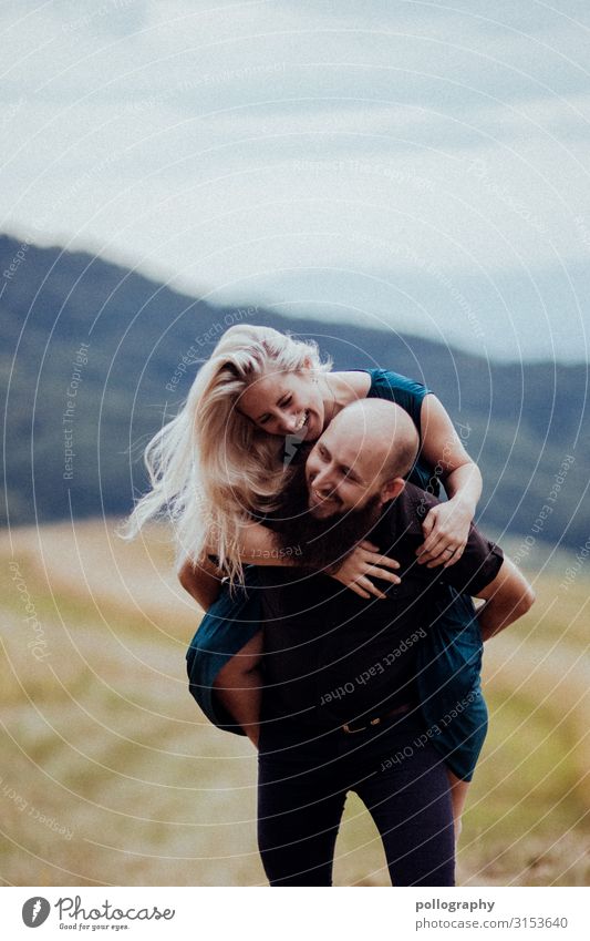 laughing couple having fun on a mountain Trust Colour photo Woman Couple Exterior shot Central perspective Rich in contrast Feminine Love sensual Happy