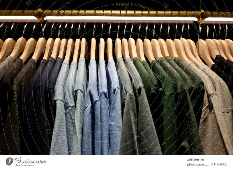 Free Stock Photo of Tshirts on wooden hangers