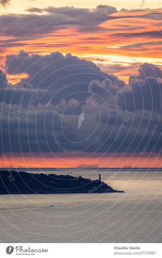 Lighthouse with a dramatic cloudy Sunrise Vacation & Travel Tourism Sightseeing Summer Summer vacation Sunbathing Water Clouds Mediterranean sea Cote d'Azur