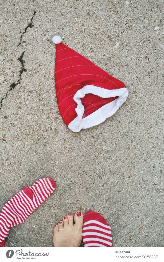 Santa Claus Christmas & Advent Santa Claus hat Street Asphalt Crack & Rip & Tear Feet Barefoot Toes Painted toenails Red Stockings Striped Tradition Strange
