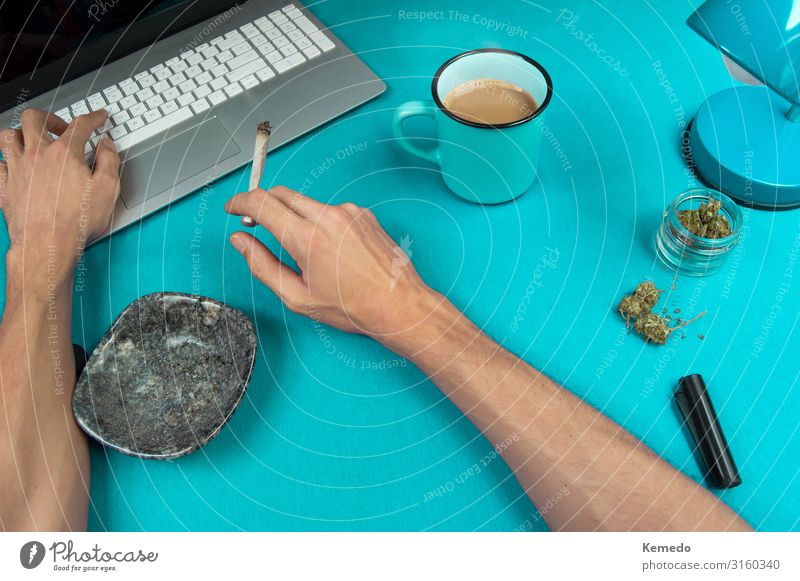 Smoking a marijuana joint while working in a blue table. Herbs and spices Breakfast Hot drink Coffee Espresso Cup Mug Lifestyle Luxury Style Design Joy