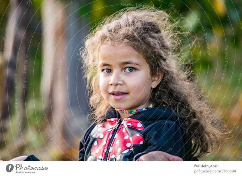 Girl with long loose dark hair Hair and hairstyles Garden Child Feminine 1 Human being 3 - 8 years Infancy Nature Jacket Brunette Long-haired Curl Smiling Free