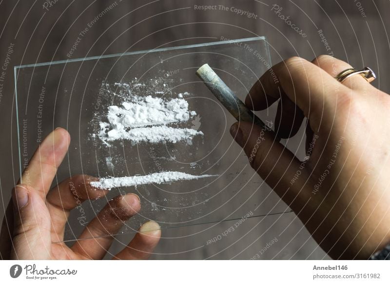 cocaine or speed in a line. addict with euro bill for snorting, - a Royalty  Free Stock Photo from Photocase