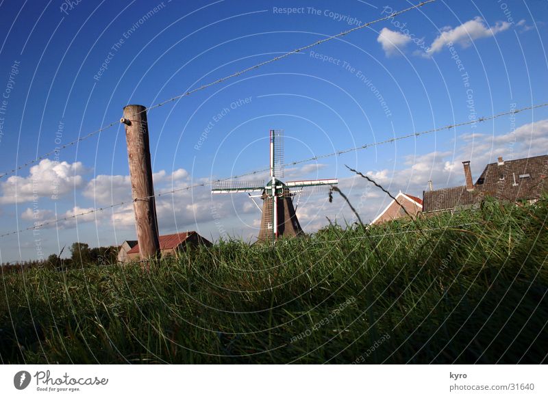 windmill Windmill Grass Green Sky Wire Fence Electronic Wood Meadow Clouds Central Blue Pole Perspective